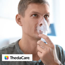 Young man using a nebulizer